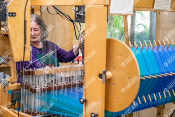 Woman using loom